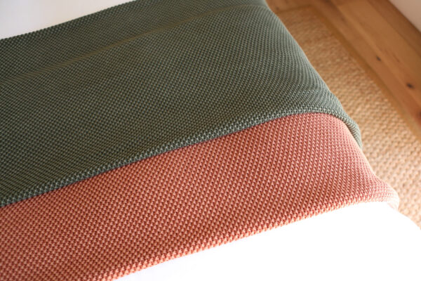 Blankets folded over chair
