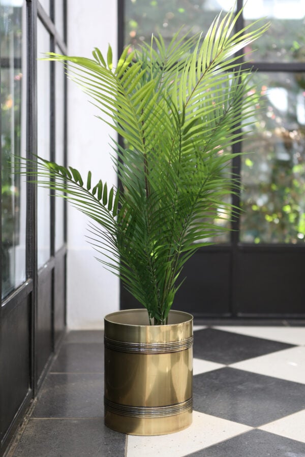 faux palm in brass plant holder