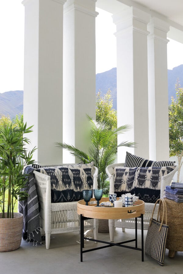 Conran table tray with malawi chairs and blue and white soft decor items