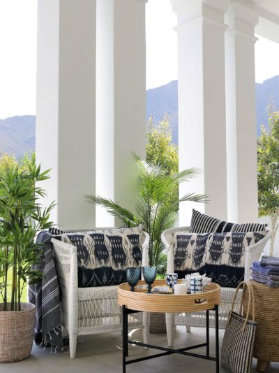Conran table tray with malawi chairs and blue and white soft decor items