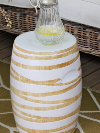 woodgrain stool with a pitcher on top