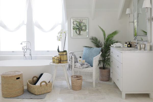 Lifestyle image of a white and light bathroom with villa lifestyle products