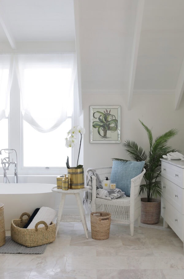 Lifestyle image of a white and light bathroom with villa lifestyle products