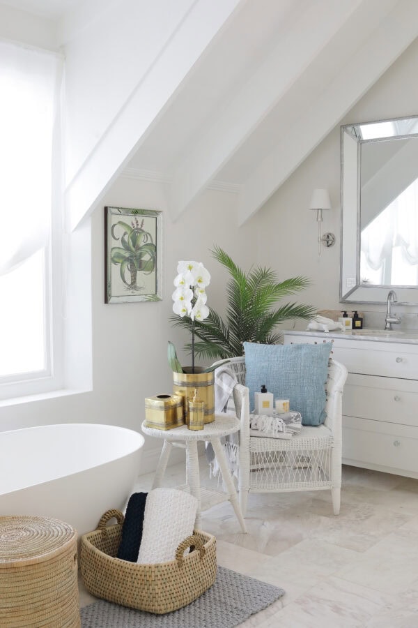 Lifestyle image of a white and light bathroom with villa lifestyle products