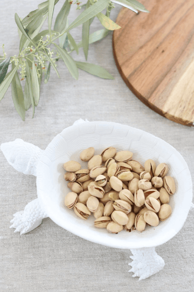 decorative turtle bowl holding nuts
