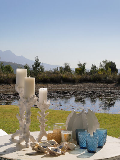Coral Candle Holders on a patio table